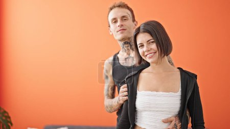 Photo for Beautiful couple smiling confident hugging each other kissing at dinning room - Royalty Free Image