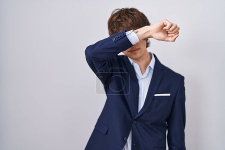 Photo for Hispanic business young man wearing glasses covering eyes with arm, looking serious and sad. sightless, hiding and rejection concept - Royalty Free Image