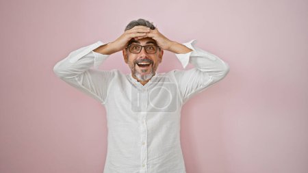 Photo for Young hispanic grey-haired man standing with surprise expression over isolated pink background - Royalty Free Image