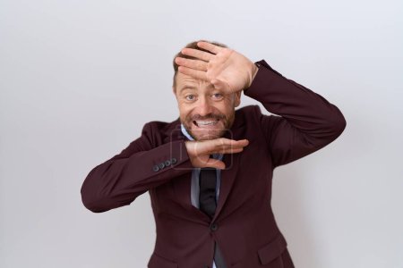 Photo for Middle age business man with beard wearing suit and tie smiling cheerful playing peek a boo with hands showing face. surprised and exited - Royalty Free Image