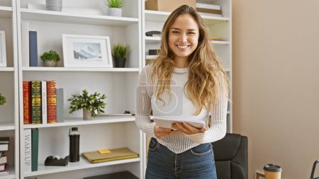 Photo for Portrait of a confident, smiling young hispanic woman at work, a beautiful, successful businesswoman holding documents in office - Royalty Free Image