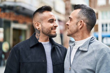 Foto de Two men couple smiling confident standing together at street - Imagen libre de derechos