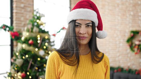 Photo for Young beautiful hispanic woman smiling confident celebrating christmas at home - Royalty Free Image