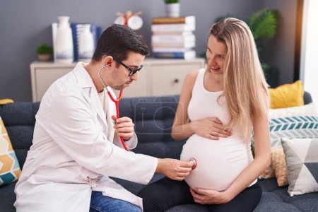 Man and woman doctor and pregnant patient auscultating baby at home