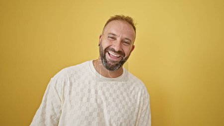 Photo for Young man laughing a lot over isolated yellow background - Royalty Free Image