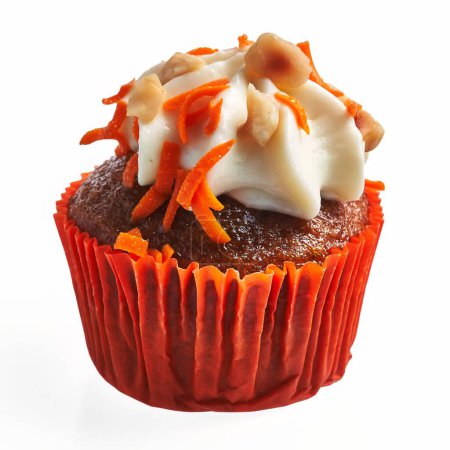 Photo for Close-up of a decadent carrot cupcake topped with cream cheese frosting and shredded carrots against a white background. - Royalty Free Image