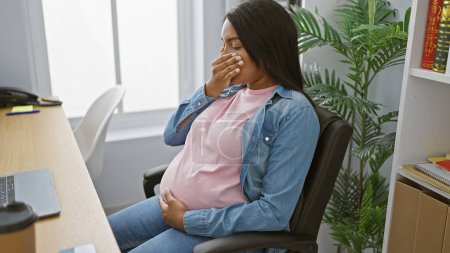 Photo for Serious young pregnant businesswoman touching belly, suffering nausea indoors at office - Royalty Free Image