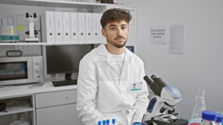 Photo for Young arab man scientist using microscope at laboratory - Royalty Free Image