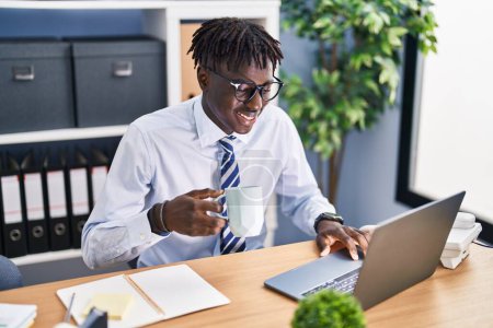 Photo for African american man business worker using laptop drinking coffee at office - Royalty Free Image