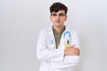 Photo for Young non binary man wearing doctor uniform and stethoscope skeptic and nervous, disapproving expression on face with crossed arms. negative person. - Royalty Free Image