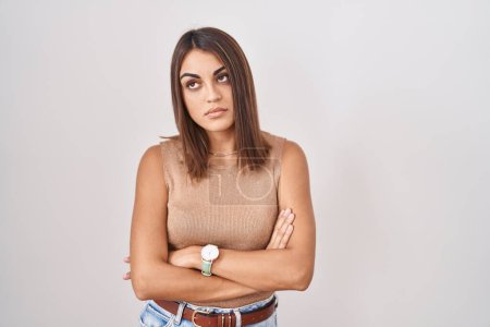 Photo for Young hispanic woman standing over white background looking sleepy and tired, exhausted for fatigue and hangover, lazy eyes in the morning. - Royalty Free Image