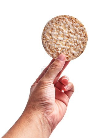 Photo for Hand of man holding single rice cake over isolated white background - Royalty Free Image
