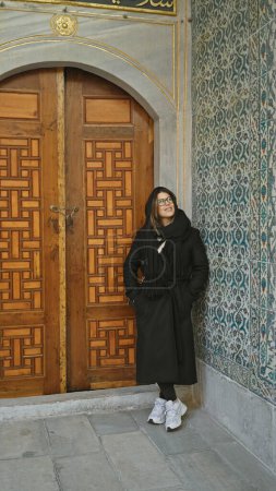 Photo for Adult woman exploring the historic topkapi palace in istanbul, showing tourism, culture, and architecture. - Royalty Free Image