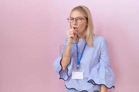 Photo for Young caucasian business woman wearing id card feeling unwell and coughing as symptom for cold or bronchitis. health care concept. - Royalty Free Image