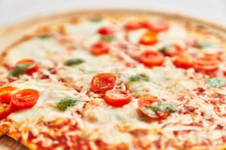 Foto de Delicious plate of caprese italian pizza over isolated white background - Imagen libre de derechos