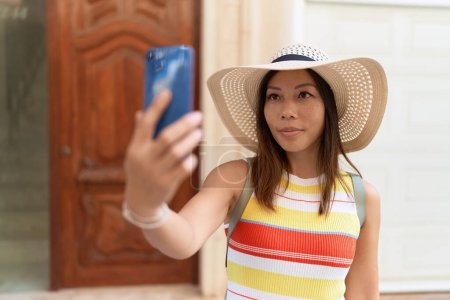 Photo for Young asian woman tourist smiling confident make selfie by smartphone at street - Royalty Free Image