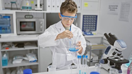 Photo for Adorable blond boy playing scientist, pouring liquid into a test tube in a cozy home lab, combining the fun of childhood with a serious interest in scientific analysis, promoting safety and learning. - Royalty Free Image