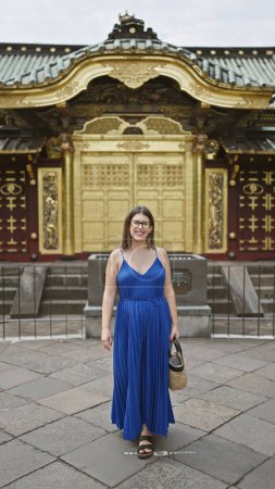 Beautiful hip latina with glasses, joy sparkling in her eyes, walking confidently at serene ueno park temple. camera captures her cheerful smile as she strides ahead under tokyo's azure sky.