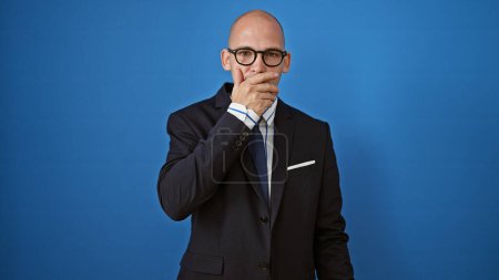 Photo for Young hispanic man business worker surprised over isolated blue background - Royalty Free Image
