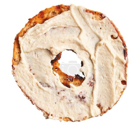 Téléchargez les photos : Gros plan d'un seul bagel givré isolé sur fond blanc, représentant un thème de petit déjeuner ou de boulangerie. - en image libre de droit