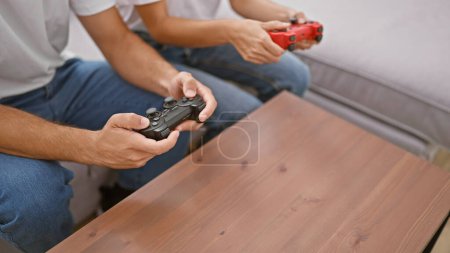 Photo for A man and woman playing video games together in a cozy living room, illustrating leisure and relationship. - Royalty Free Image