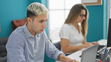 Photo for Two workers man and woman working together at the office - Royalty Free Image