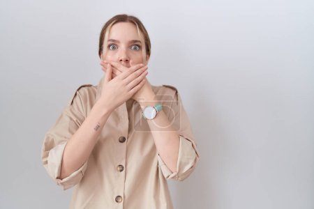 Photo for Young caucasian woman wearing casual shirt shocked covering mouth with hands for mistake. secret concept. - Royalty Free Image