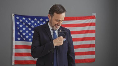 Photo for Mature man smiling indoors with american flag symbolizing patriotism, leadership, and national pride. - Royalty Free Image