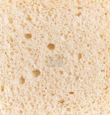 Téléchargez les photos : Texture en gros plan du pain blanc présentant une structure poreuse détaillée adaptée aux concepts de la nourriture et de la cuisson. - en image libre de droit