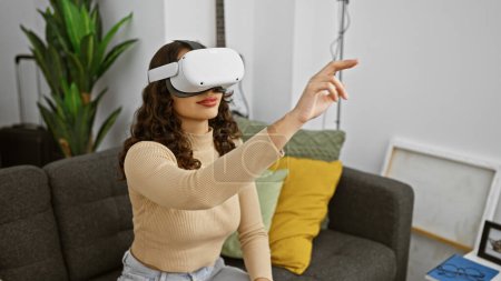 Young woman wearing vr headset interacts with virtual content in her modern living room