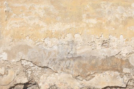 Photo for Texture of an old brick wall with fallen plaster. Background of a shabby building surface. - Royalty Free Image