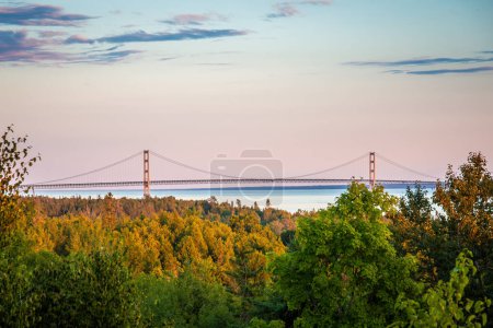 Photo for Sunset late summer westside of Mackinac Bridge fall colors in foreground - Royalty Free Image