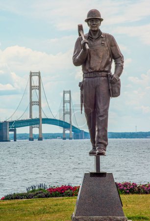 Photo for Fallen bridge construction workers with Mackinac Bridge background - Royalty Free Image