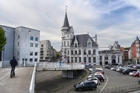 Photo for LIEGE, WALLONIA, BELGIUM - SEPTEMBER 2023: View from passenger bridge on historical building la Grand Poste de Lige, the former main post office built in gothic revival architecture - Royalty Free Image