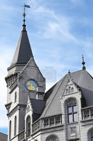 LIEGE, WALLONIA, BELGIUM - SEPTEMBER 2023: Detail of the historical building la Grand Poste de Lige, the former main post office built in gothic revival architecture by the Belgian architect Edmond Jamar