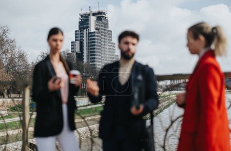 Modern professionals enjoying a casual meeting with coffee by a cityscape on a sunny day