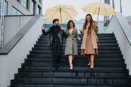 Three stylish friends with umbrellas walking down city stairs, enjoying a rainy day.
