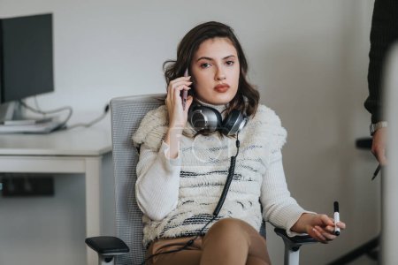 Confident businesswoman discussing ideas in corporate office during phone call, analyzing market research data for innovative strategies and profitability.