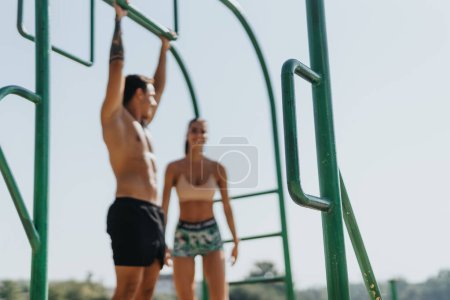 Friends Challenge Their Muscles and Motivation with Outdoor Pull Ups in a Sunny Park