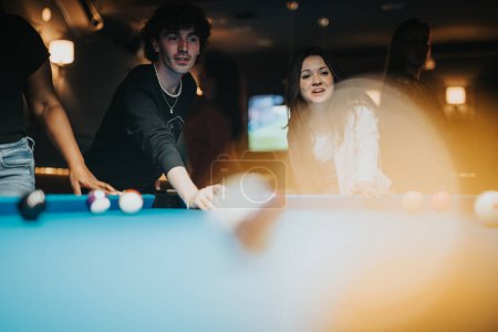 A joyful group of friends share happy moments playing billiards in a lively bar atmosphere during a night out.