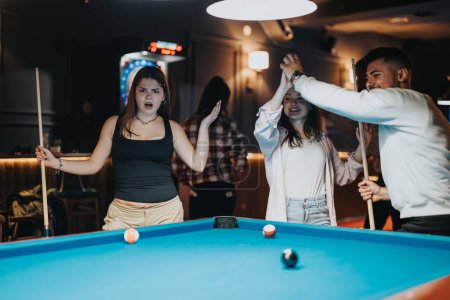 A group of friends share a joyful night out playing pool in a bar, expressing a mix of concentration and excitement.