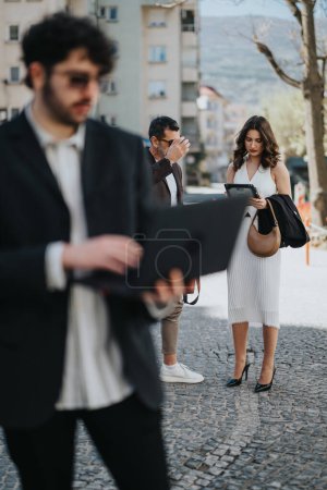Busy professionals in formal attire walking through an urban setting, focused and determined.