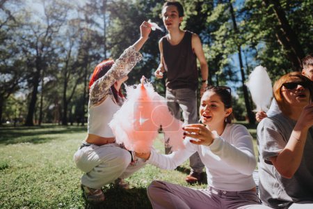 A joyful group of friends sharing candy floss in a sunlit park, capturing moments of happiness, freedom, and recreation