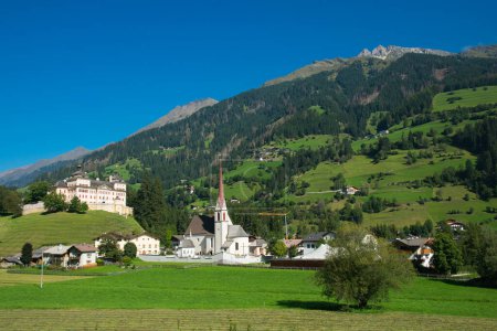 View of Mareit - Mareta (Racines - Ratching) village in Italy, south Tyrol. Mareta is located at the valley entrance of the Val Ridanna (Ridnaun) and is enthroned by castle Wolfsthurn, a mighty Baroque castle