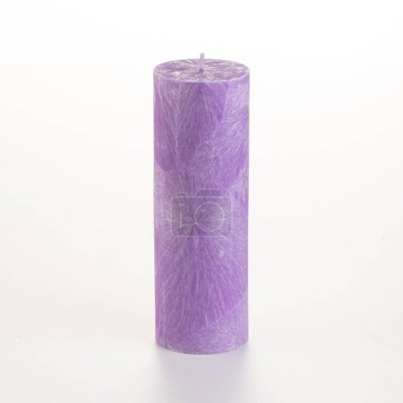 Photo for Tall handcrafted purple palm wax candle with unique crystalline texture, displayed on white backdrop. Stylish accessory for interior design - Royalty Free Image