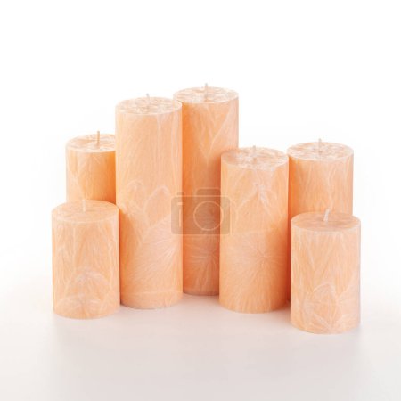 Photo for Natural peach palm wax pillar candles of varying heights; featuring unique ice pattern texture grouped on white background. Handmade accessories for refreshing interior decor - Royalty Free Image
