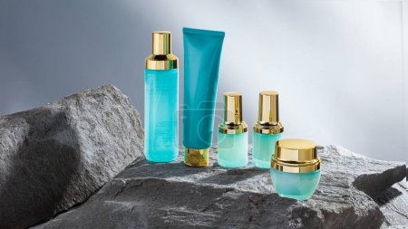 Contrast of textures: a delicate, nourishing skincare collection in elegant turquoise bottles with gold cap details against the rough and rugged gray surface of natural stone