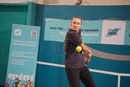 Photo for Almaty, Kazakhstan - 11.30.2022 : Elena Rybakina. Grand Slam champion Wimbledon 2022 in singles. After the press conference, she poses for the media with a racket. - Royalty Free Image