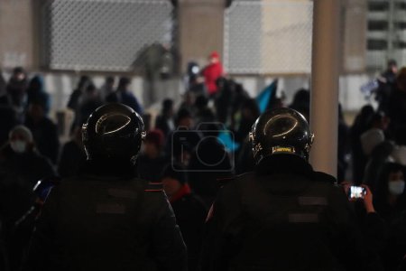 Photo for Almaty, Kazakhstan - 01.04.2022 : The police are lined up in front of the protesters on the central square near the city hall. Mass riots. - Royalty Free Image