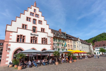 Photo for FREIBURG, GERMANY - MAY 6, 2023: On the square near Freiburg Cathedral - Royalty Free Image